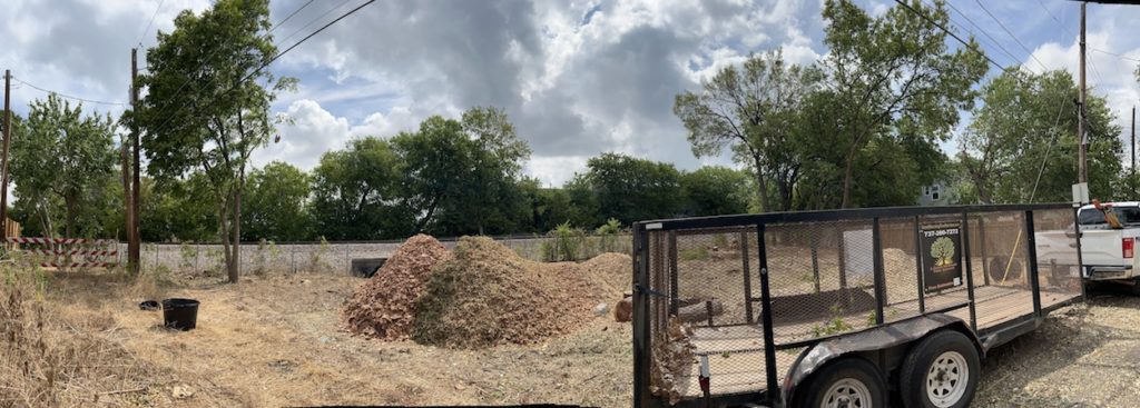 Photo of a property lot in Austin, TX, fully cleared of brush and trees by A Good Morning Tree Service.